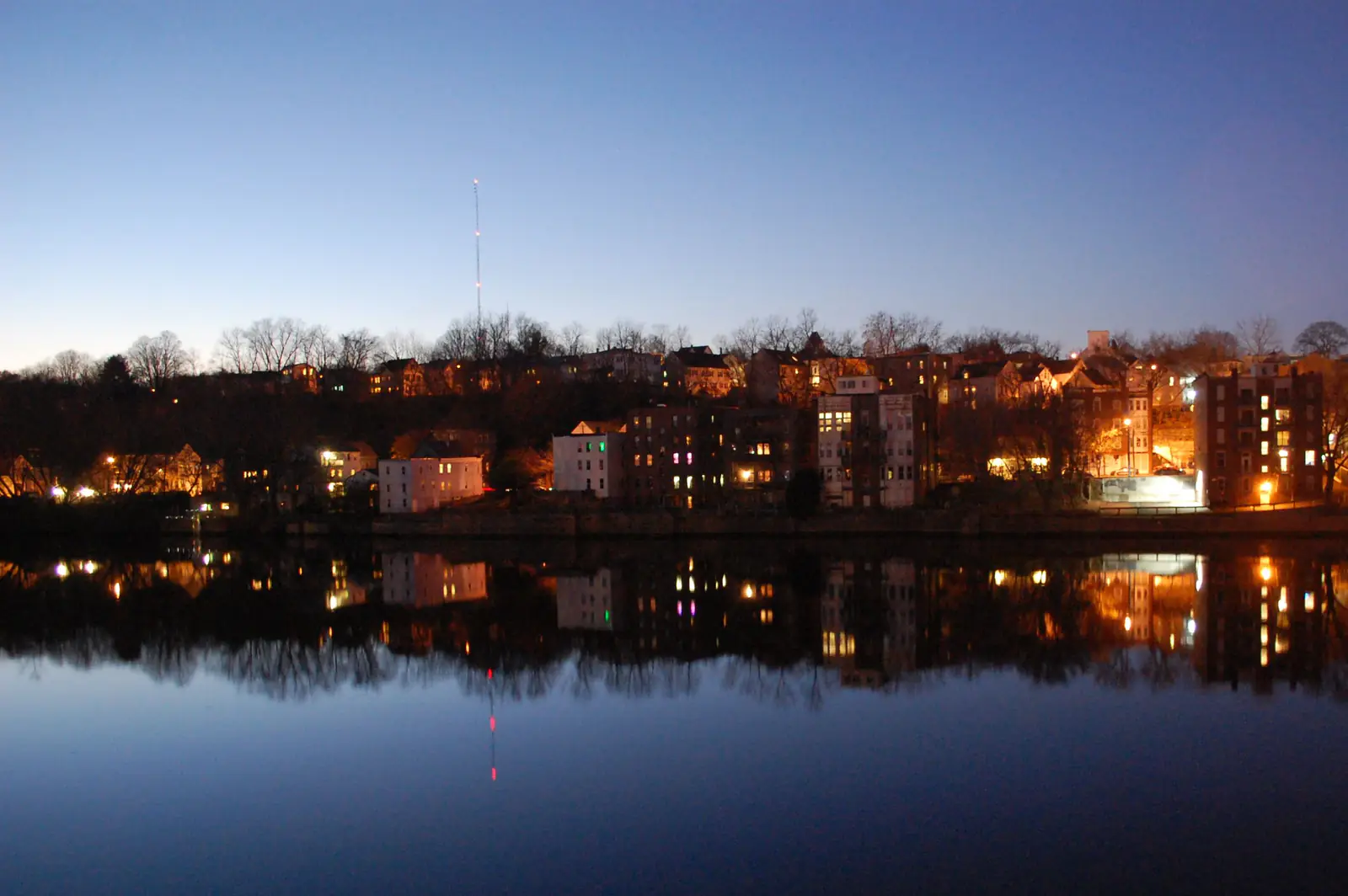 Downtown Haverhill, Massachusetts, lit up at dusk and reflected in the Merrimack River